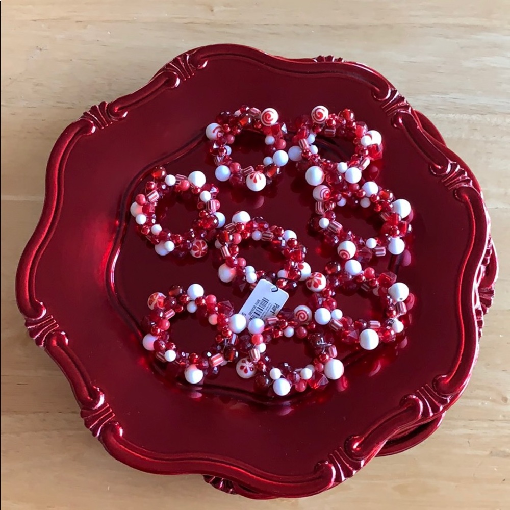 4 Red Chargers & 8 napkin ring holders